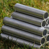 MainframeDirect -small tubes piled high on lawn 
